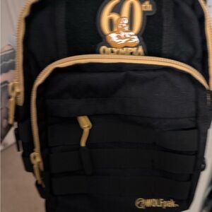 Olympia exclusive Wolfpak Black and Gold crossbody Backpack